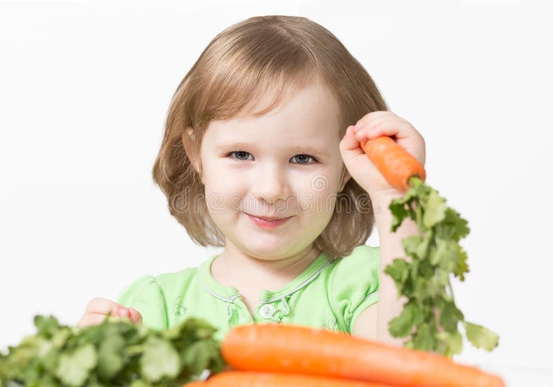 Smiling Child Eating a Carrot Stock Photo Image of beauty, green