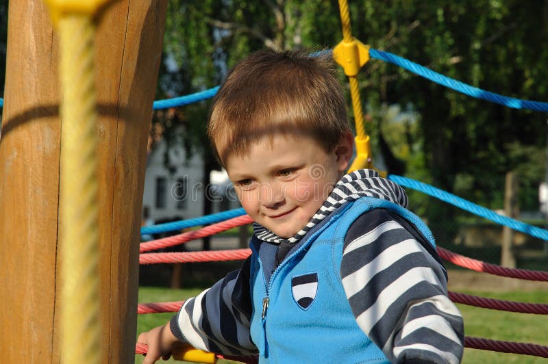 Smiling child playing on playground