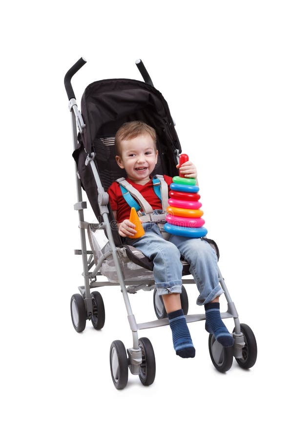 Child sitting in pram stock image 