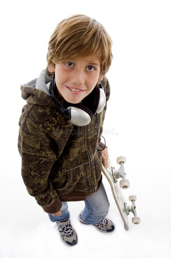 Smiling child with skateboard and headphone