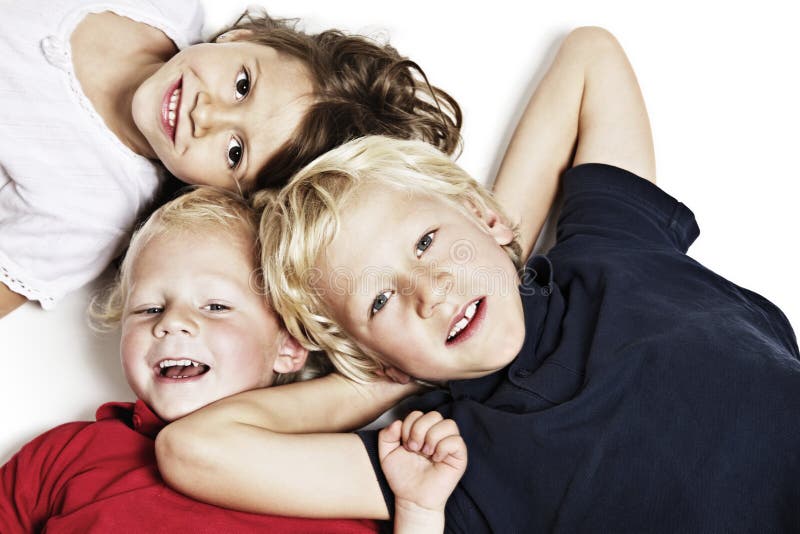 Smiling children on floor looking up