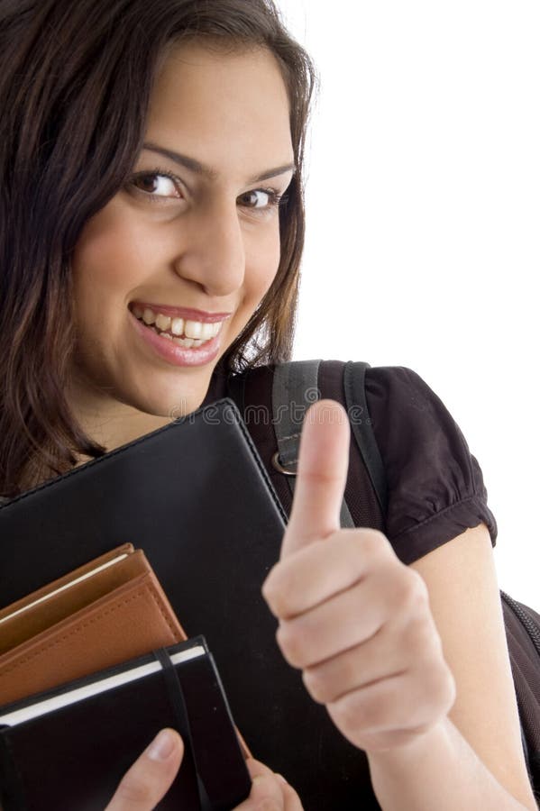 Smiling college student showing thumbs up