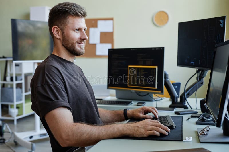 Smiling Computer Programmer at Workplace stock image
