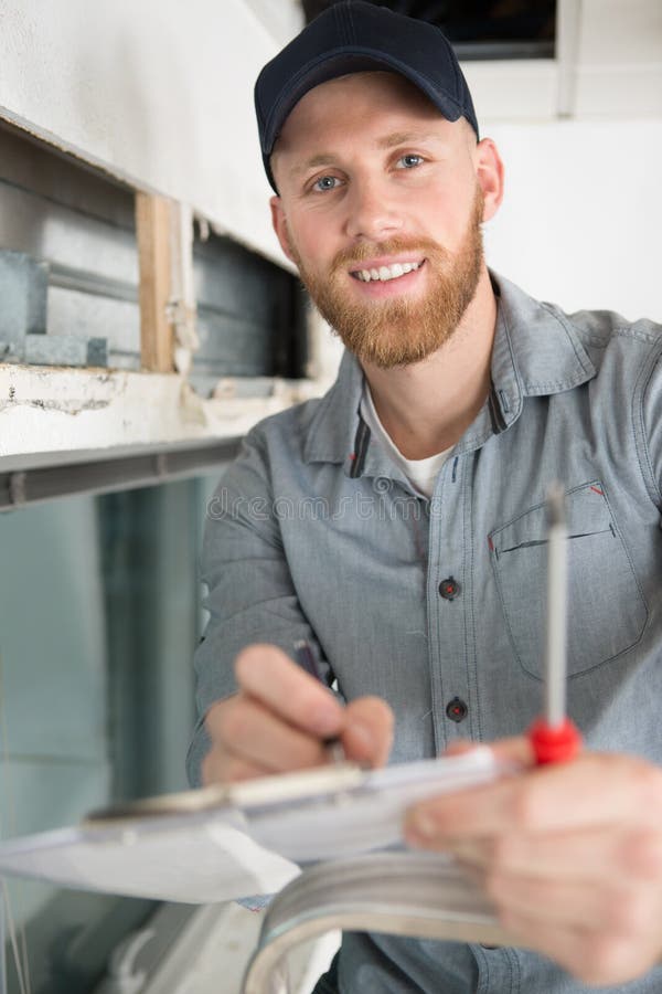 A Smiling Construction Inspector Stock Photo Image of adult, indoors