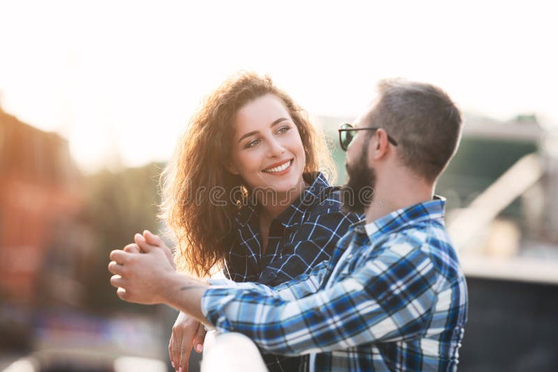 Smiling couple in love, walking and talking outdoors royalty free stock photography