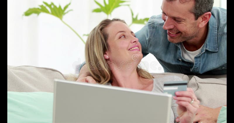 Smiling couple making online shopping