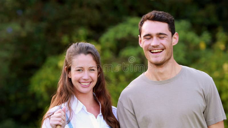 Smiling couple ready to gardening