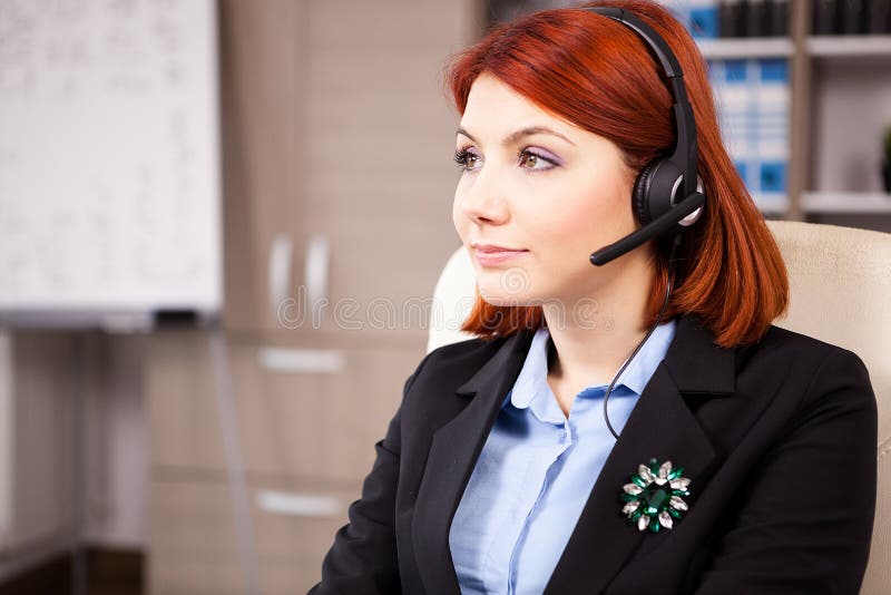 Smiling Customer Service Support Working in the Office Stock Image