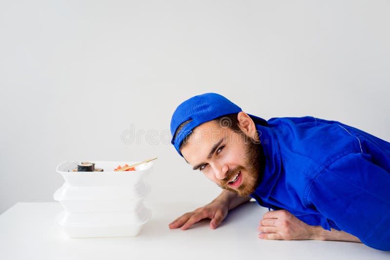 Smiling delivery guy royalty free stock image