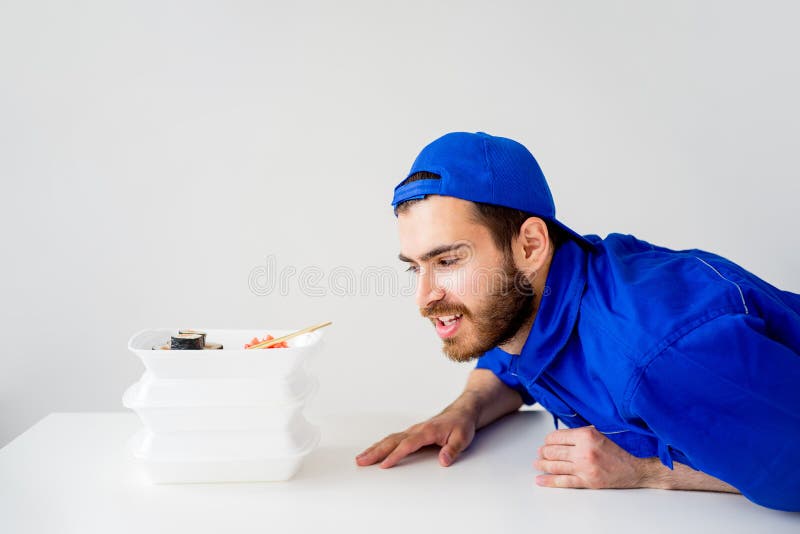 Smiling delivery guy stock image