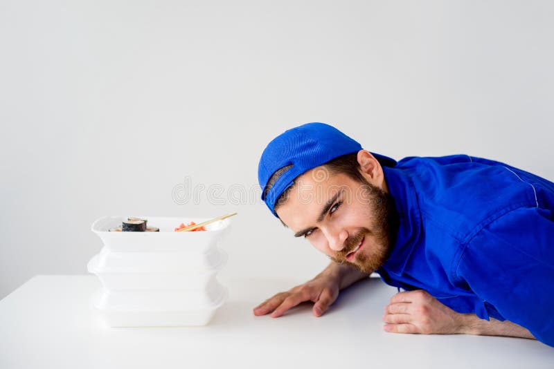 Smiling delivery guy stock photography