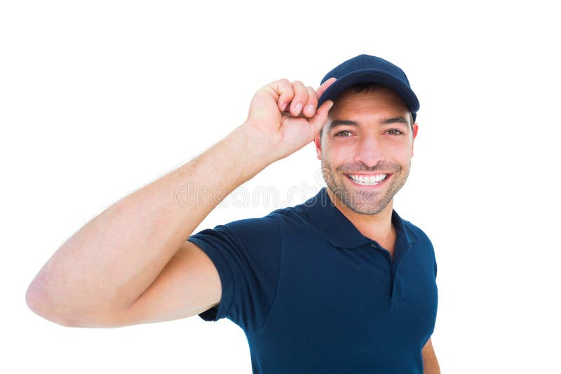 Smiling delivery man wearing cap on white background royalty free stock photo