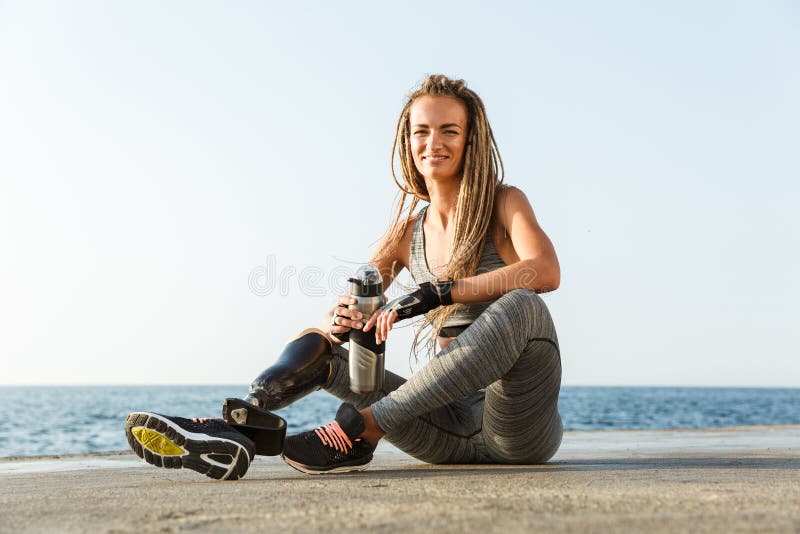 Beautiful woman with prosthesis leg Stock Photo by oneinchpunchphotos