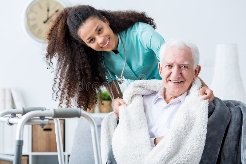 Smiling doctor caring about patient stock image