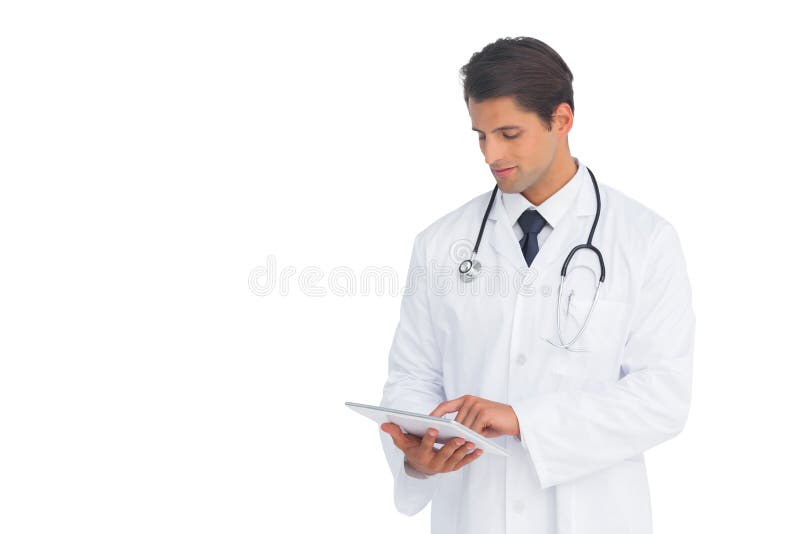 Smiling doctor using a tablet royalty free stock images