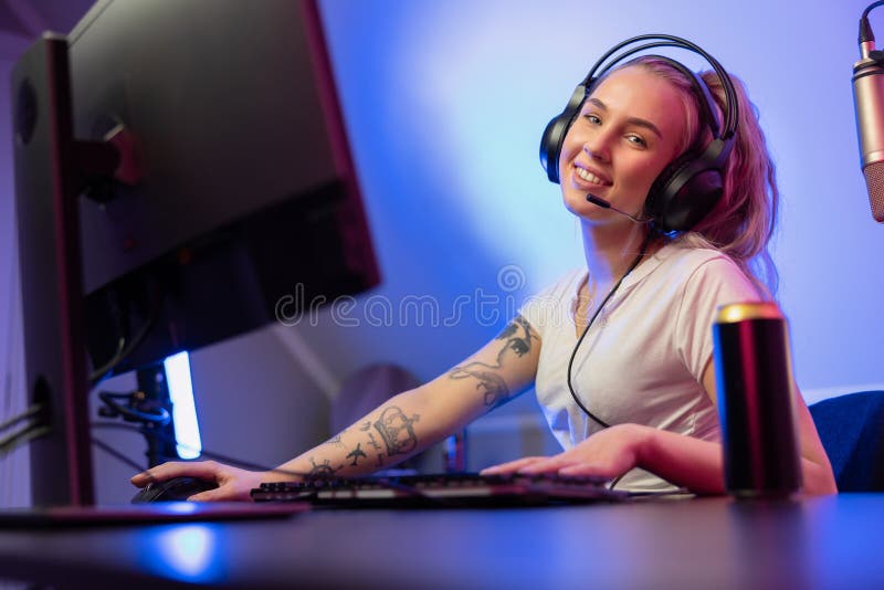 Footage of Young Asian esport woman gamers playing online video games on  the computer with neon light at home. Attractive girl gaming player feels  enjoy technology broadcast live streaming. 25213471 Stock Video