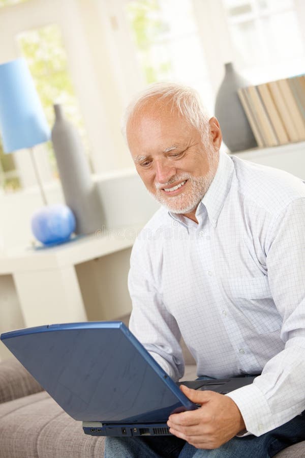 Smiling Elderly Man Looking at Computer Screen Stock Photo - Image of