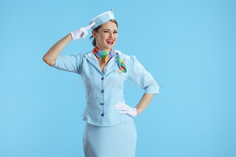 Smiling Elegant Female Air Hostess on Blue Salutes Stock Image - Image ...