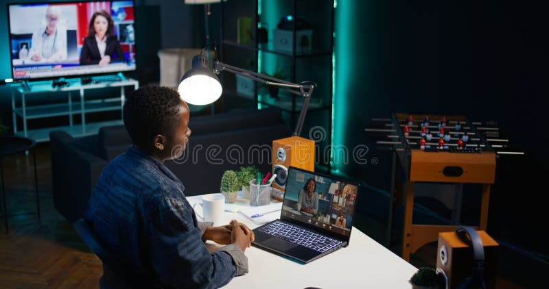 Cheerful worker waving hand, greeting coworkers in teleconference stock photo