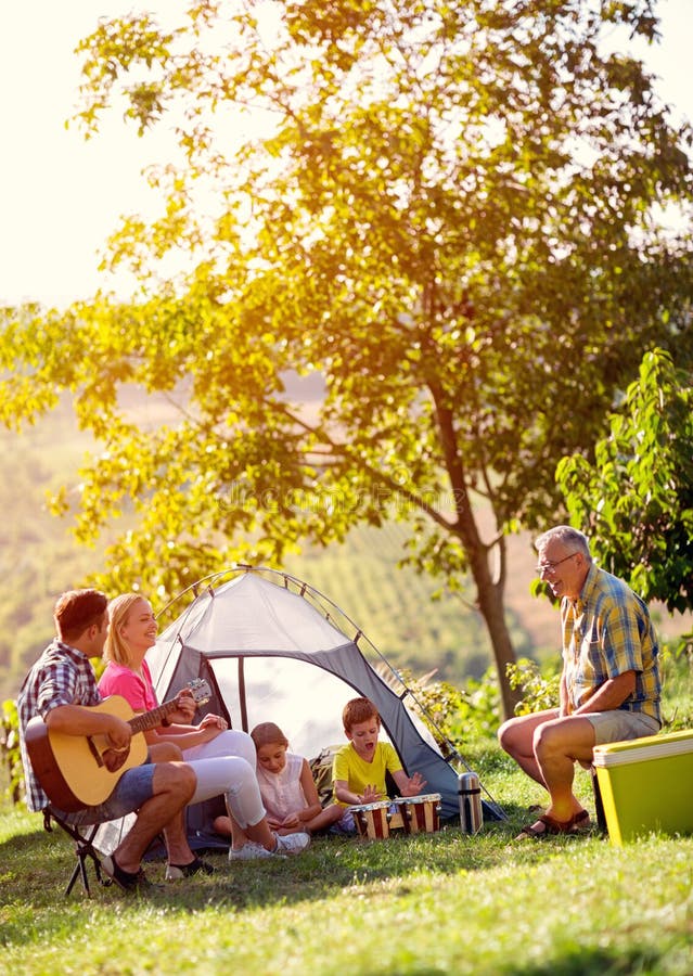 Smiling family enjoying picnic stock photos Smiling family enjoying picnic stock photos
