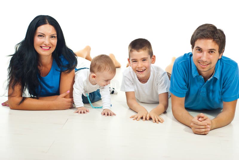 Smiling family lying on floor