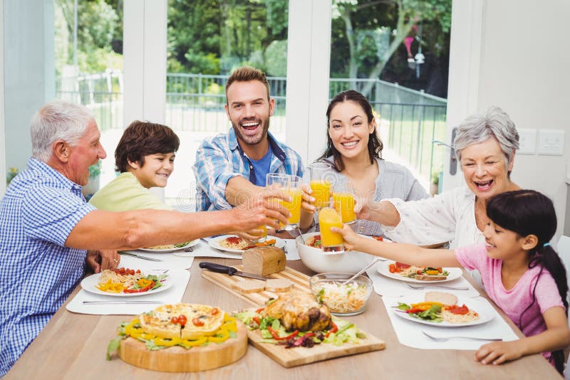 Parents Toasting with Wine in Christmas Dinner Stock Photo - Image of ...