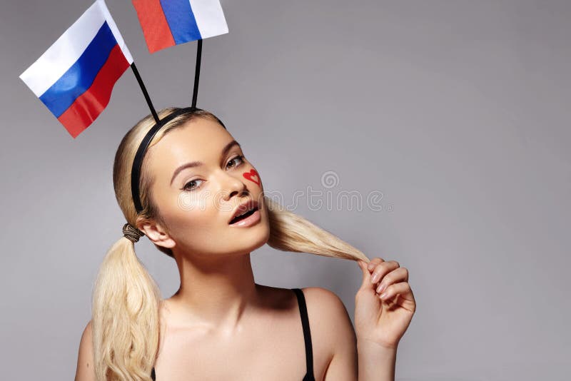 Smiling Fan with Russian Flag. Woman Expressing Emotion of Joy. Championship, Football game. Love, Peace and Unity stock photography Smiling Fan with Russian Flag. Woman Expressing Emotion of Joy. Championship, Football game. Love, Peace and Unity stock photography