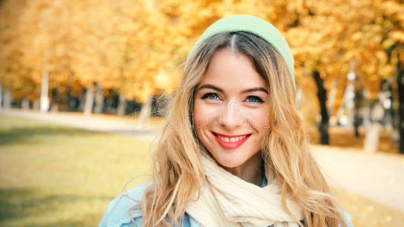 Smiling Fashion Hipster Girl on Autumn Background