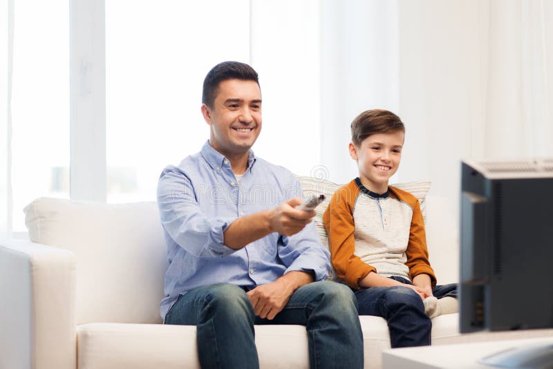 Smiling Father And Son Watching Tv At Home Stock Image Image Of Happy Male 69408871