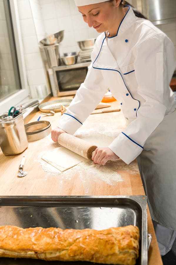 Baker is rolling a dough stock photo. Image of cooking 65132770