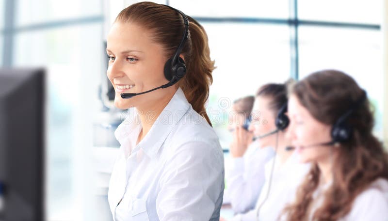 Smiling female customer service representative talking on headset stock photography Smiling female customer service representative talking on headset stock photography