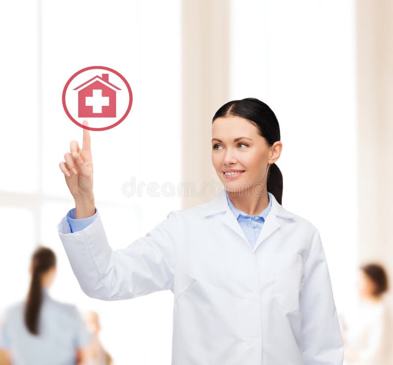 Healthcare, medicine and technology concept - smiling female doctor pointing to hospital sign