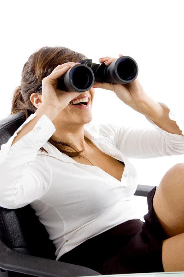 Smiling female looking through binoculars