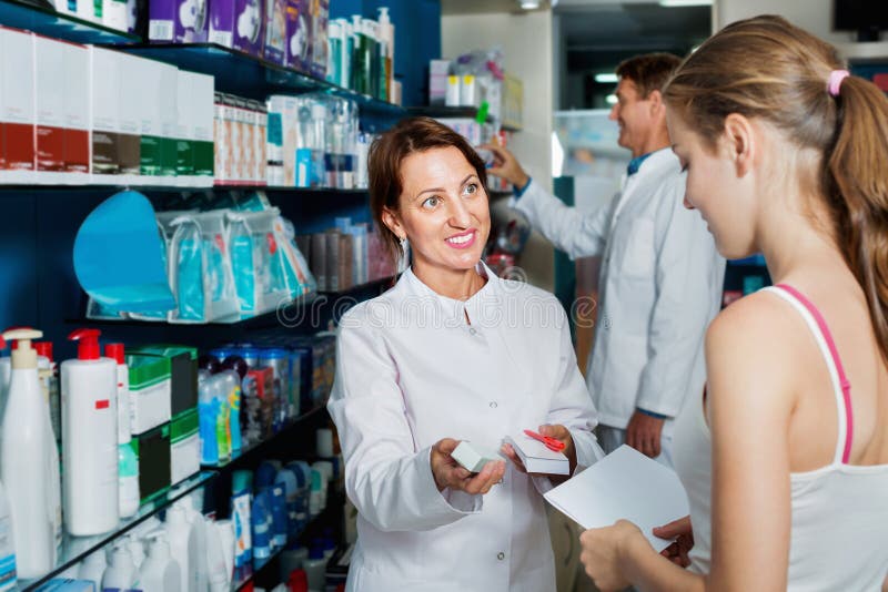 Smiling Female Pharmacist Wearing Uniform Working Stock Photo - Image ...