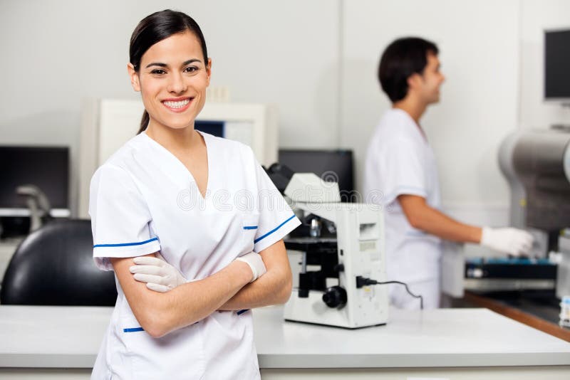 Smiling Female Scientist In Laboratory stock photo Smiling Female Scientist In Laboratory stock photo