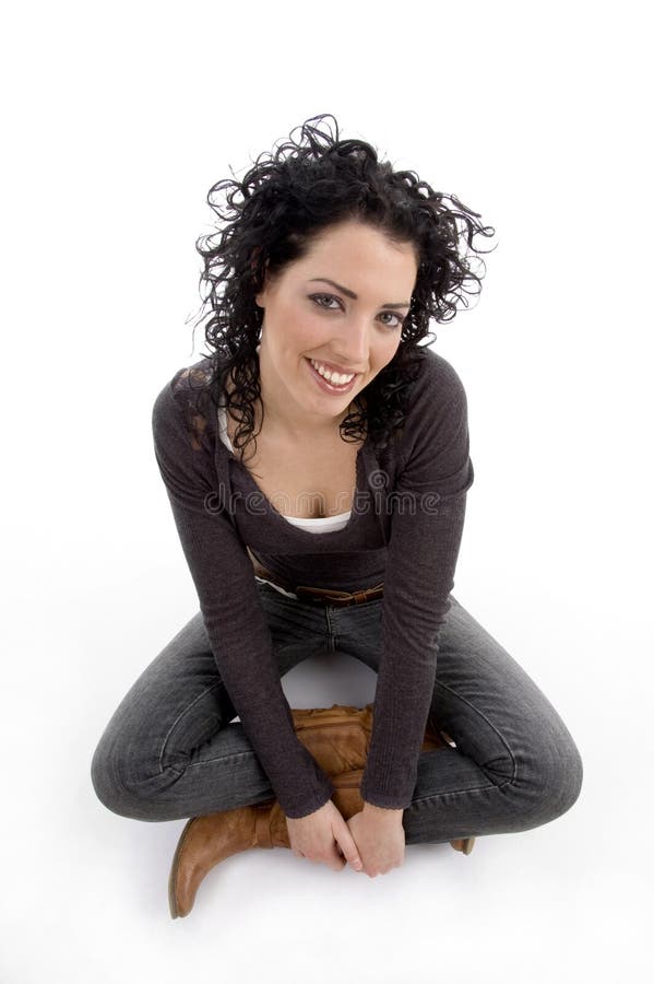 Smiling female sitting on ground