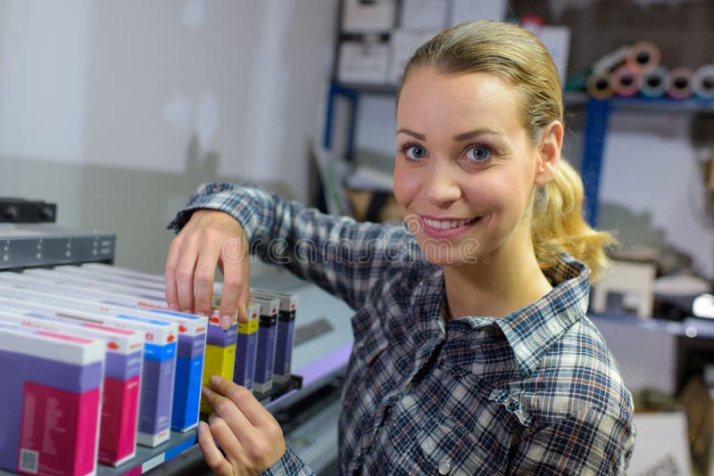 Smiling female working in library stock photo
