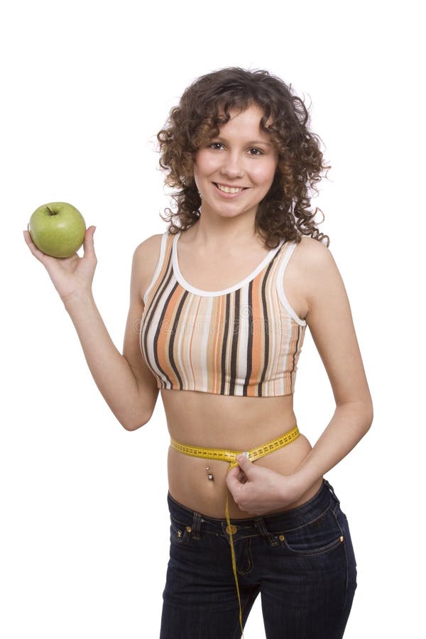 Smiling fit woman with measure tape and apple.