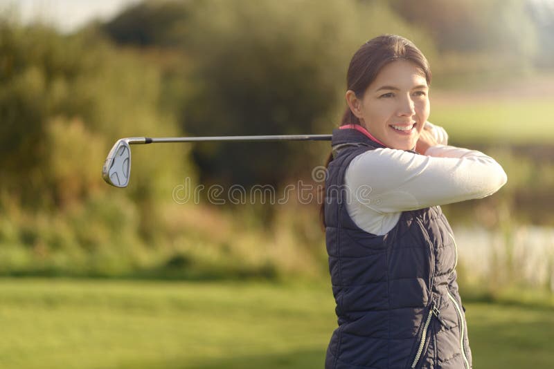 Smiling friendly young woman golfer stock photos Smiling friendly young woman golfer stock photos