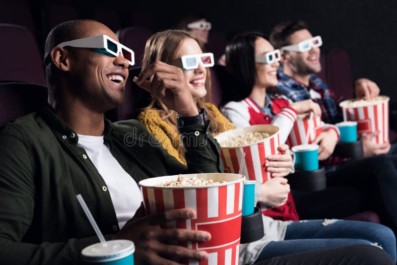 smiling friends in 3d glasses with popcorn and soda watching movie