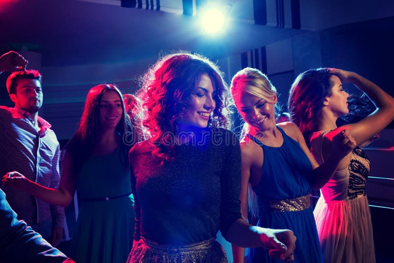 Smiling Friends Dancing in Club Stock Photo - Image of club, nightclub ...