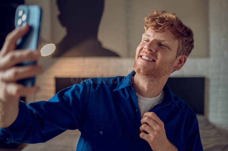 Smiling Ginger Man Making Selfie and Looking Confident Stock Photo