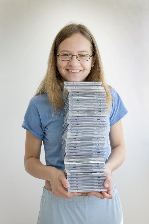 Smiling girl with her cds