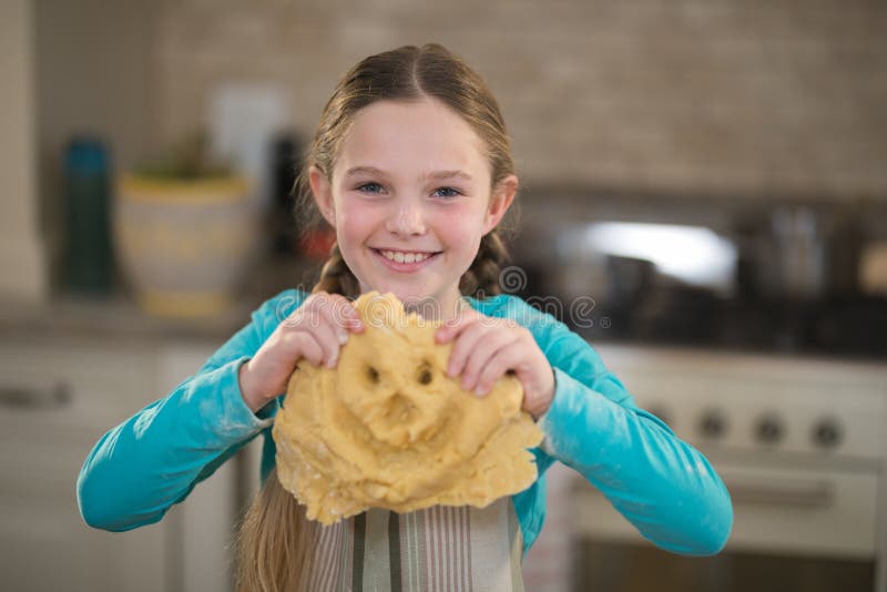 Smiling Girl Holding Dough in Kitchen Stock Image Image of child