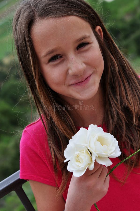 Smiling girl holding roses