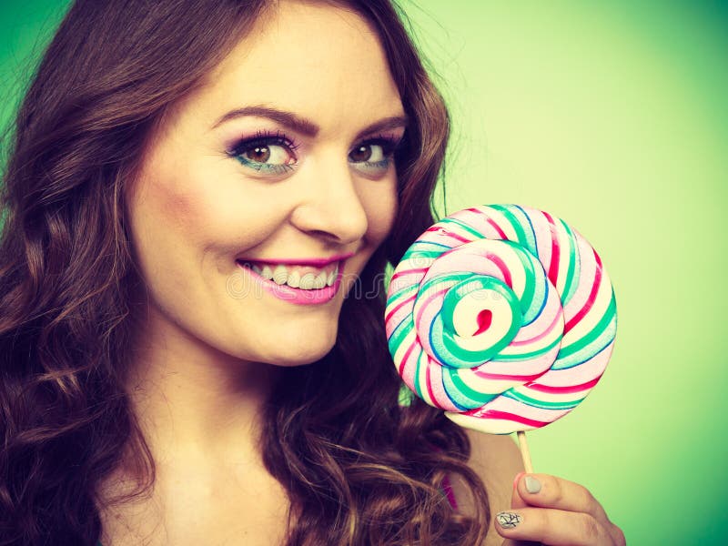 Smiling Girl With Lollipop Candy On Green Stock Photo Image Of Girl