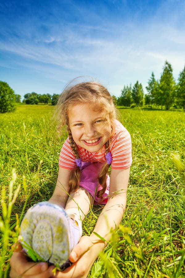 Smiling Girl Making Leg-split on Grass in Summer Stock Photo - Image of ...