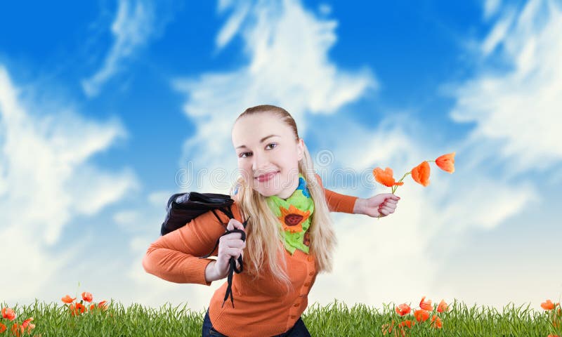 Smiling girl on a meadow