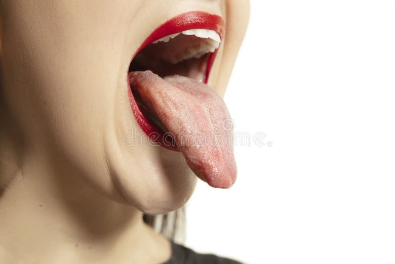 Smiling girl opening her mouth with red lips and showing the long big giant tongue isolated on white background, crazy royalty free stock image Smiling girl opening her mouth with red lips and showing the long big giant tongue isolated on white background, crazy royalty free stock image