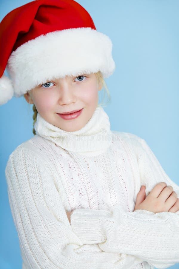 Smiling girl in Santa hat stock photo. Image of female - 34875184